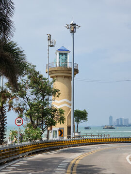 Bali Hai Lighthouse on the coastal curved road with sea and Pattaya skyline view, Chonburi, Thailand