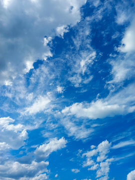 Dynamic Blue Sky with White and Gray Clouds and Streaky Cirrus