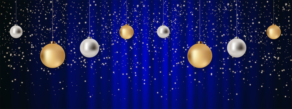 Elegant Christmas background with hanging gold and silver baubles, glowing stars and festive sparkles over a luxurious deep blue satin backdrop