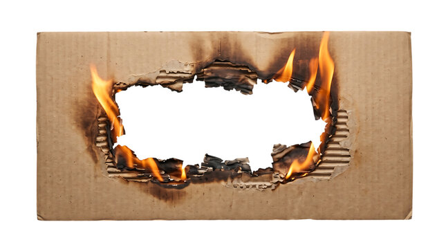 Rectangular burnt hole in corrugated cardboard with flames active flames fire damage burning edge