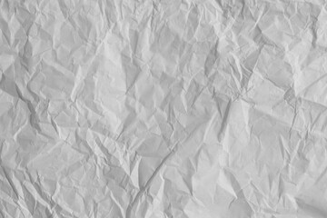 Fototapeta premium White crumpled paper texture with realistic wrinkles, folds, creases and natural shadows. Detailed neutral surface for graphic design, print, packaging, collage, stationery, mockups and overlays.