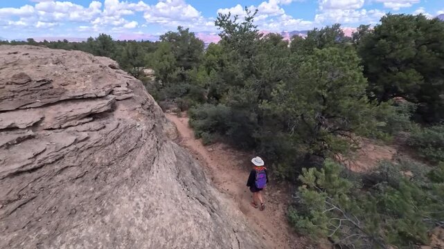 Explore the stunning Gander Trail as a lovely senior woman enjoys hiking through Utahs breathtaking natural beauty.