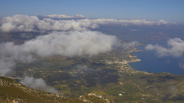 Spring in Crete, mountainside, stone walls, settlement, above the clouds, snow-capped mountains, Pachia Ammos, Mirabello Bay, Dikte Massif, Thripti Mountains, Thripti, north coast, east Crete, island of Crete, Greece