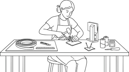 Fototapeta premium Woman crafting leather goods at her workshop desk table
