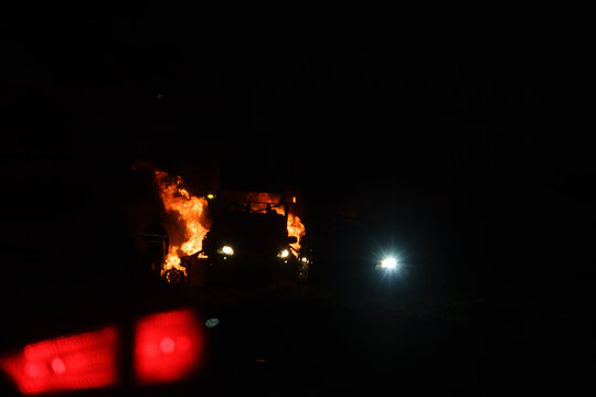 Berridale, New South Wales, Australia - September 29, 2026: Car on fire burning on side of Kosciuszko Road just north of Berridale with emergency crews attending