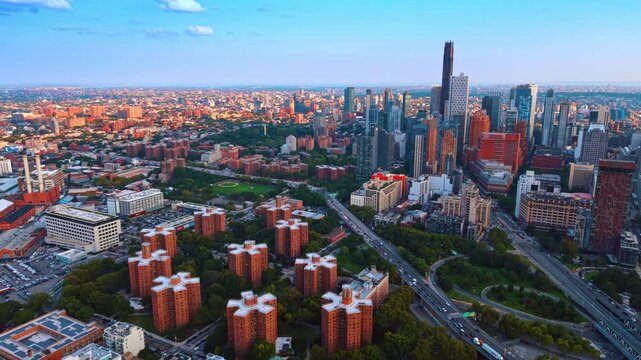Cityscape of modern New York City, USA with lush greenery. Drone footage over group of distinct similar high-rises of red brick.