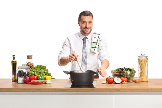 Man cooking and mixing food in a pot with a wooden spoon