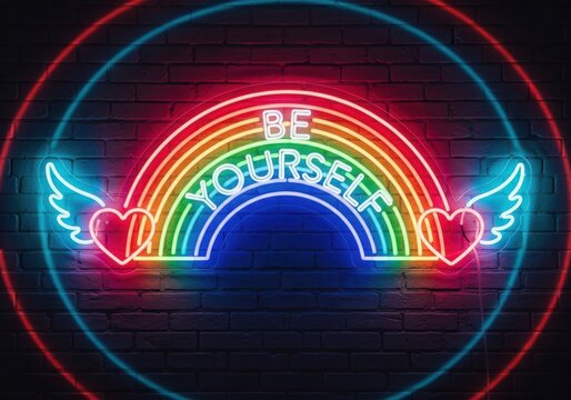 Neon rainbow sign with wings and heart saying be yourself