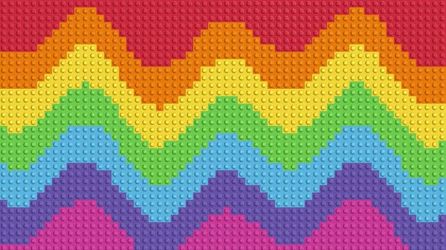 Colorful rainbow chevron pattern made of toy building bricks texture