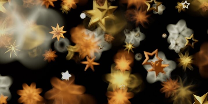 A vibrant display of golden and white star bokeh lights on a dark background.