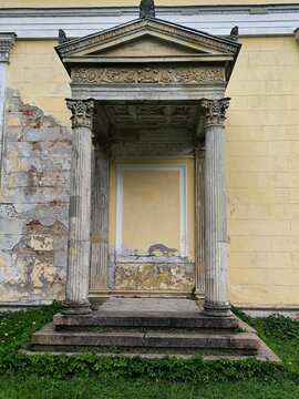 Weathered classical portico with Corinthian columns, near Saint Petersburg