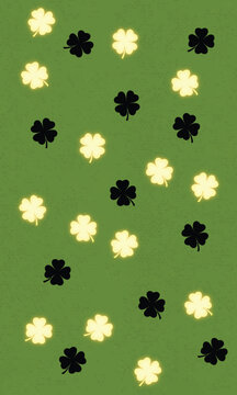 glowing yellow and black four leaf clovers pattern on olive green textured background