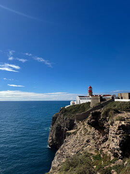 Cape St. Vincent lighthouse above Atlantic cliffs in Portugal. Sagres, Atlantic Ocean