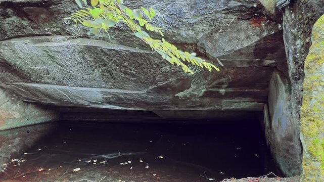 an ancient stone quarry used to make millstones and grinding stones, with beautiful patterns carved into the stone by human hands