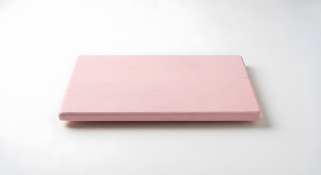 Pink wooden cutting board on white background