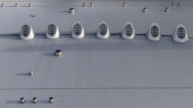 Aerial view of a corrugated metal shopping mall roof with a row of arched skylights in Iceland.