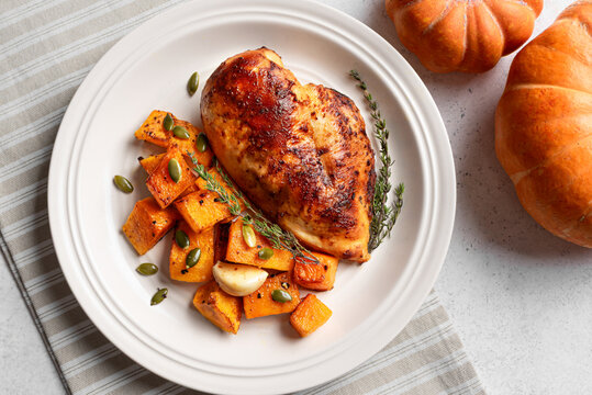 Autumn meal: roasted chicken with pumpkin and herbs