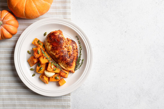 Autumn meal: roasted chicken with pumpkin and herbs