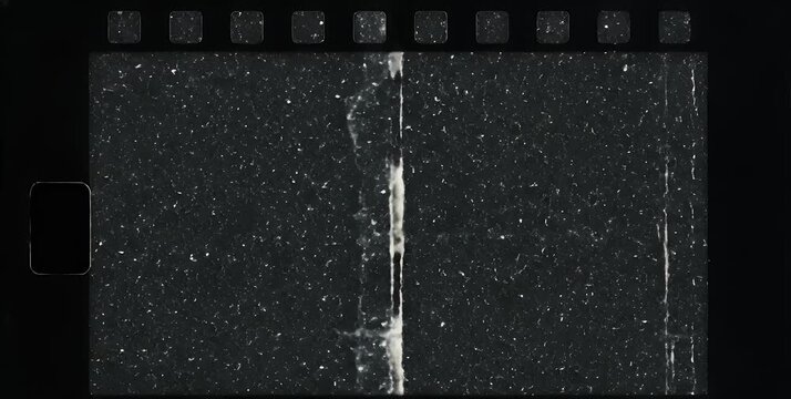 Close-up of a vintage, dark, and heavily scratched film strip with visible dust and grunge texture, showing signs of wear and tear.
