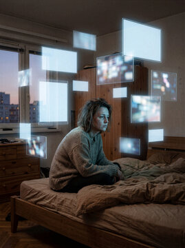 Digital Fatigue Burnout Concept Woman Sitting on Bed Surrounded by Holographic Screens Representing Information Overload Technology Stress Mental Health Challenges Virtual Connection Issues Modern