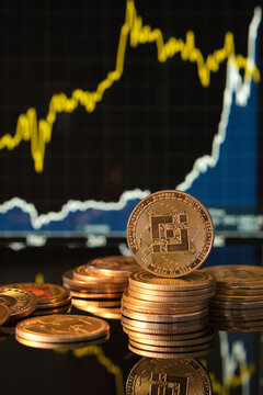Binance Cryptocurrency in Focus With Market Trends Displayed Behind