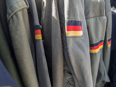 Vintage German Military Uniforms Displayed for Sale