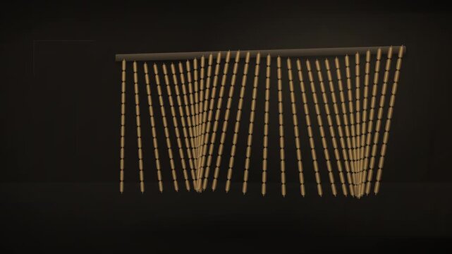 A string of hanging wooden beads against a dark background in interior design studio