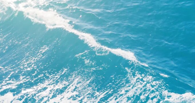 Ocean sea blue wave background. Surface of tropical empty wake of moving water in motion on sunny summer day.