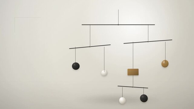 Minimalist hanging kinetic sculpture with geometric spheres and rectangular shapes on thin metal rods