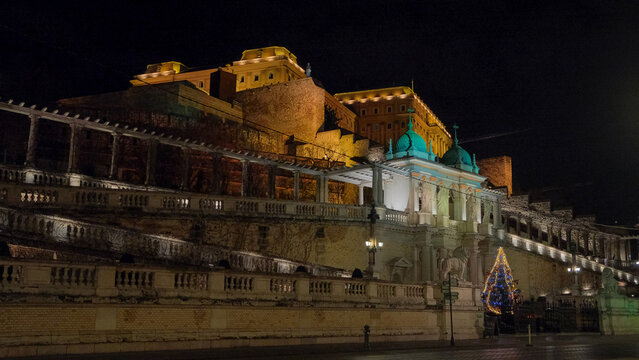 Night view of the illuminated Varkert Bazar, or Castle Garden Bazaar, with its neo-Renaissance pavilions, terraces and stairways below Buda Castle in Budapest, Hungary.