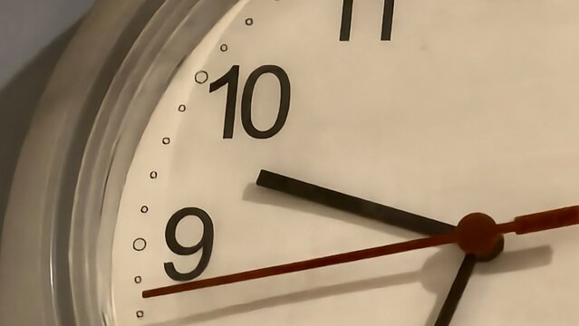 Close up of a wall clock showing the 10 o clock time