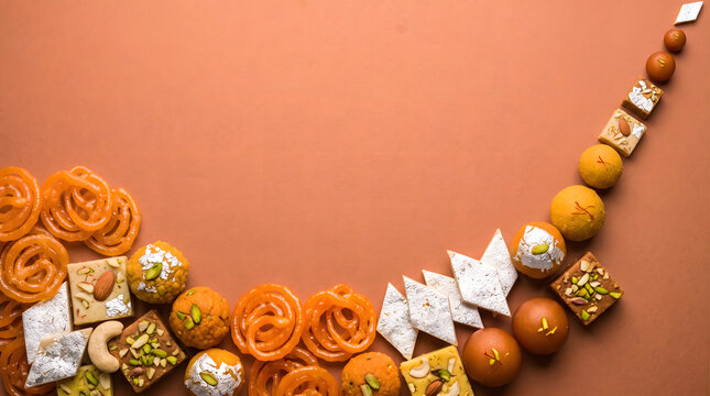 Delicious traditional Indian sweets assortment arranged beautifully with copy space for festive celebrations and special occasions
