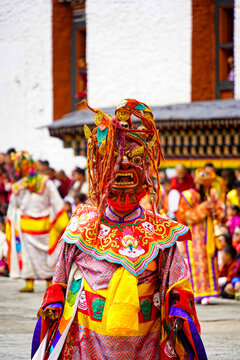 Drubchen festival, Dromchoe festival, mask dancing, Tashichho Dzong, Thimphu Dzong, Colorful traditional mask costume dancer performing at cultural festival parade, Thimphu, Bhutan, SEP 2026