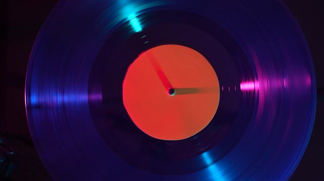 Spinning vinyl record with orange label