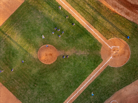 Aerial view of a baseball field with players in position on the diamond during a game in Santo Domingo, Distrito Nacional, Dominican Republic.