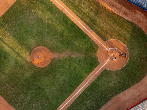 Aerial view of a baseball field with a pitcher on the mound and players near home plate in Santo Domingo, Distrito Nacional, Dominican Republic.
