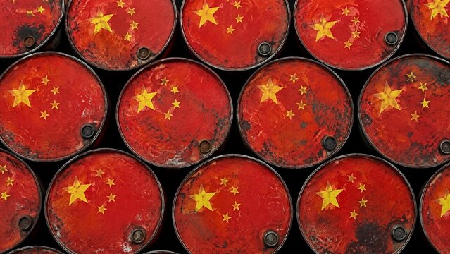 Top down view of stacked red steel oil barrels painted with the Chinese national flag concept of petroleum reserve