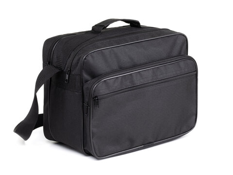 Black textile travel bag with pockets and shoulder strap isolated on white background, three quarter view