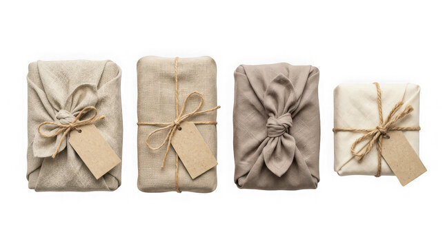 Four gifts wrapped in linen cloth with tags isolated on transparent background