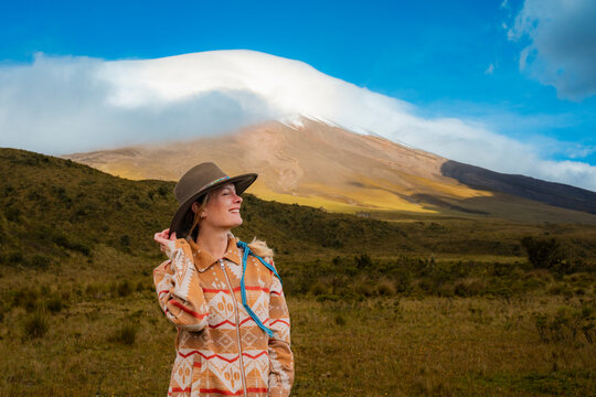 Woman traveler near Cotopaxi volcano in Ecuador