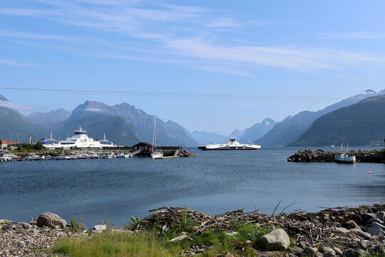 Solav&aring;gen ferry terminal with car ferries on the fjord in Norway. Beautiful coastal landscape at Solav&aring;gen with mountains and boats in M&oslash;re og Romsdal.