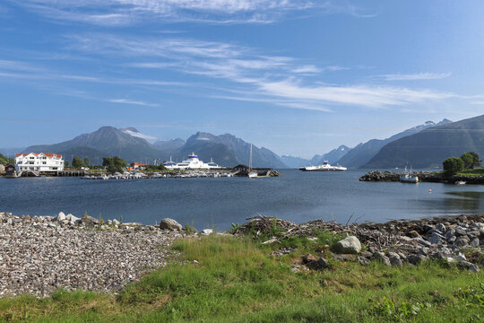 Solav&aring;gen ferry terminal with car ferries on the fjord in Norway. Beautiful coastal landscape at Solav&aring;gen with mountains and boats in M&oslash;re og Romsdal.