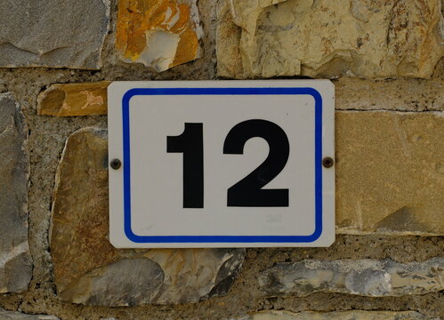 House number plate 12 close-up, Seborga, Italy