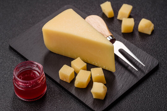 Hard aged Parmesan cheese in blocks and cubes for home cooking. Parmesan cheese