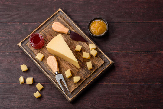 Hard aged Parmesan cheese in blocks and cubes for home cooking. Parmesan cheese