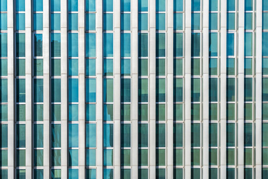 Modern office building facade with blue glass windows
