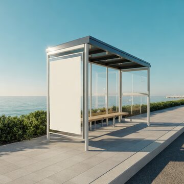 Modern bus stop shelter with a blank vertical advertising billboard by the sea. Ideal for urban mockup and outdoor.