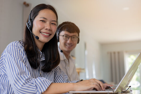 close up young asian employee woman and man work as call center for providing data and information to customer for business concept