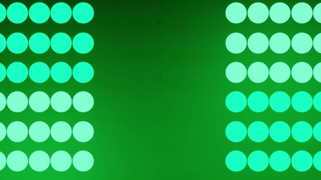 Twin Columns of Illuminated Dots Framing an Empty Green Center Stage