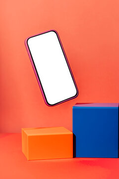 Floating smartphone with blank screen and colorful geometric blocks